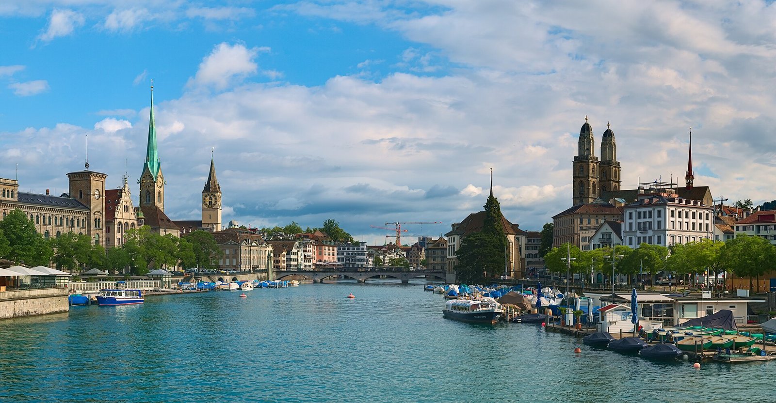 Zurich landmarks beside the Limmat, photographed by Daniel Kraft